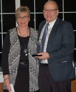 AAESA Superintendent, Mark Dobias, receives the Education Professional award from PNC Manager, Deb Heather.